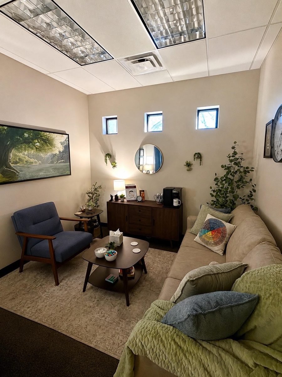 Robin's counseling office in Glendale, Arizona — a warm seating area with couch and plants